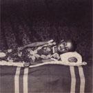 Burmese girl on a bed